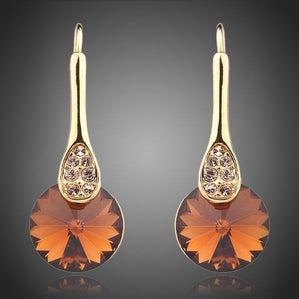 náušnice visiace s oranžovými krištáľmi